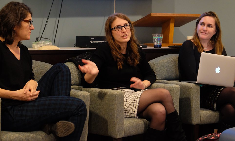 Three panelists at a discussion