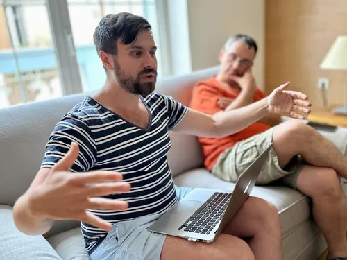 Man talking while sitting on a couch