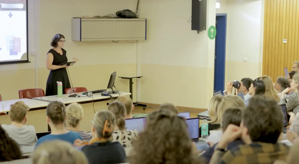 Meredith Martin delivers a speech in a lecture hall