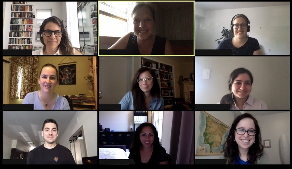 Zoom video call showing faces of nine different people working from home.