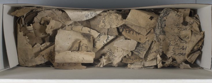 A box that contains fragments of documents