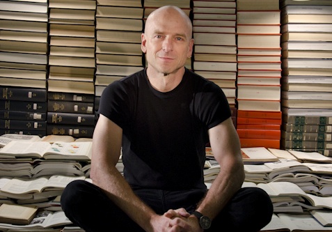 jeffrey schnapp seated in front of stacks of books